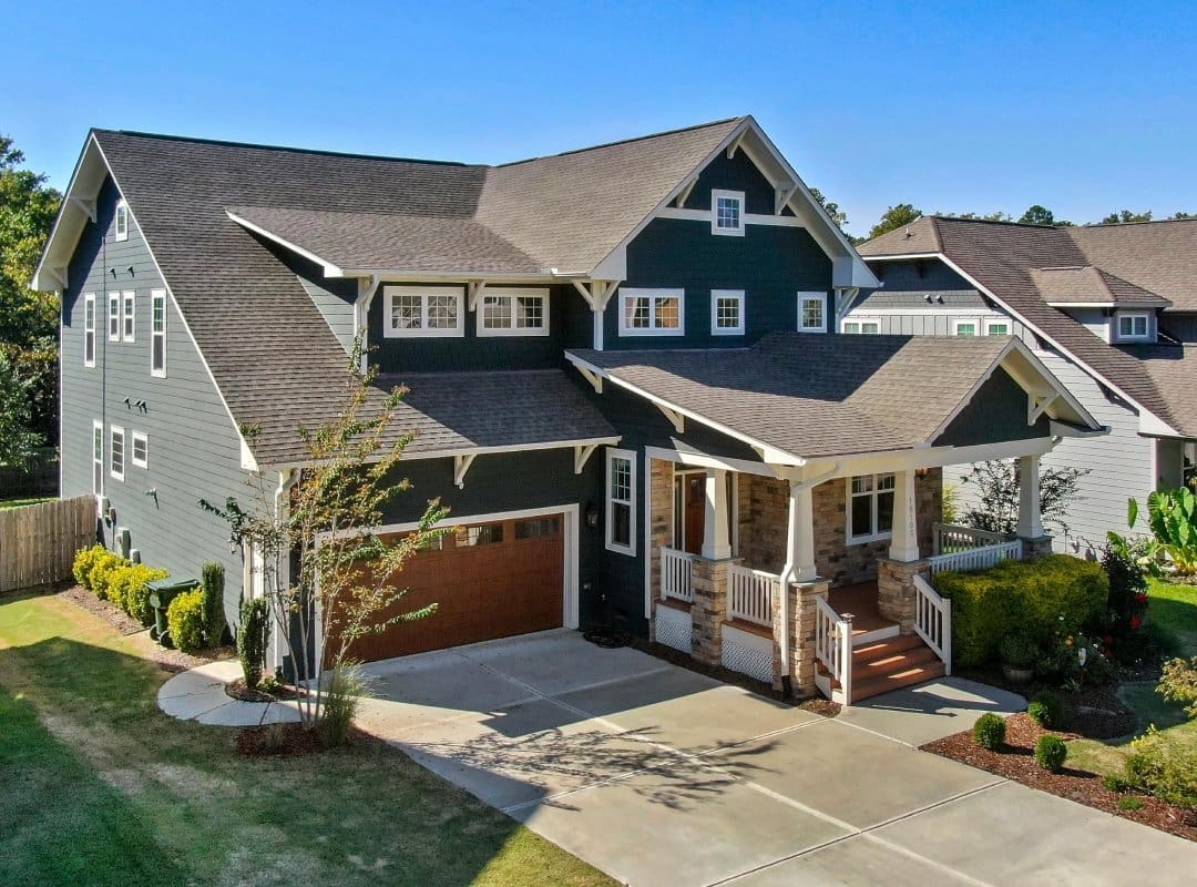 A large house with a garage and driveway.