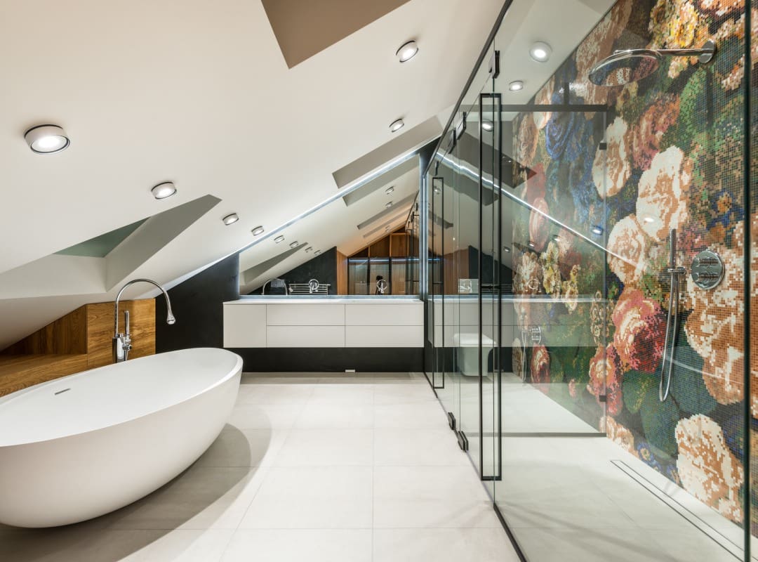 A bathroom with a large painting on the wall.